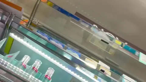 Asian Teen in Plaid Skirt Exposes Herself in Store