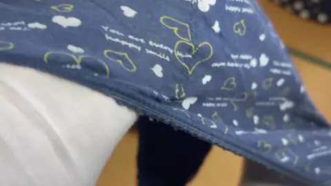 Asian Teen Undresses in Living Room