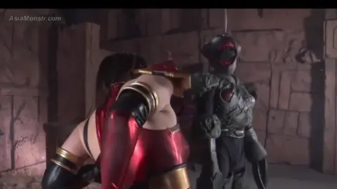 Asian cosplayer in red costume with muscular warrior