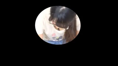 Asian Teen in White Shirt and Jeans