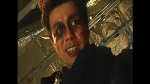 Asian Schoolgirls Kissing in Classroom