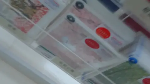 Asian Woman in Card Store