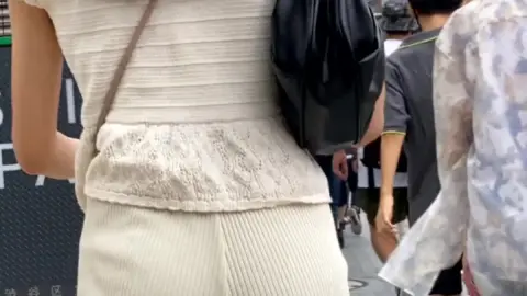 Asian Woman on City Street