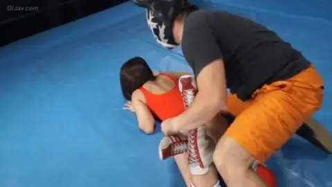 Asian Wrestlers Engage in Intimate Wrestling Matches