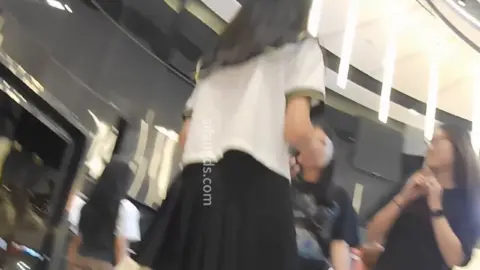 Asian Teen in School Uniform at Mall