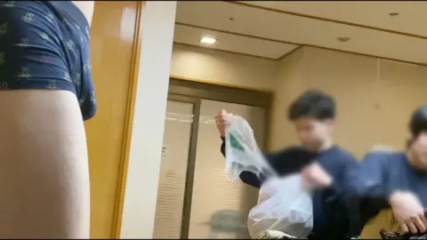 Asian Men in Changing Room