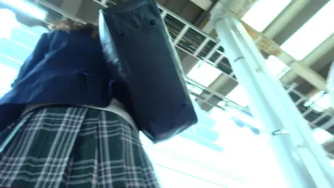 Asian Teen in Skirt on Train
