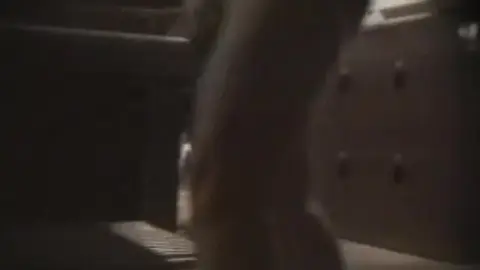 Asian Couples Changing Clothes in Locker Room