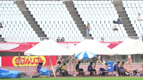 Asian Athletes at Track and Field Stadium