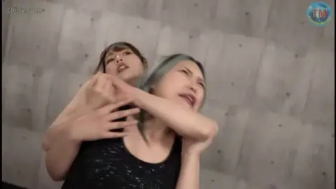 Asian Lesbians Engaging in Wrestling and Choking