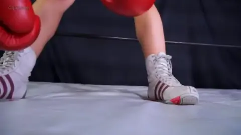 Asian Women Engage in Boxing Match