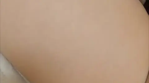 Asian Couple Intimacy in Dimly Lit Bedroom