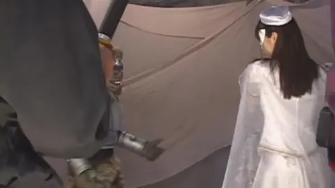 Asian Performers in Costumes and Face Paint