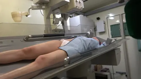 Dark-Haired Girl in Medical Exam