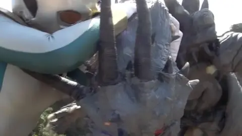 Asian Women in Costumes Embracing Outdoors