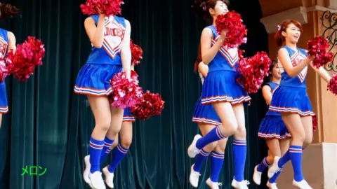 Asian Teen Cheerleaders Perform Routine