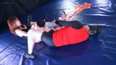 Asian Wrestlers Engage in Intimate Contact