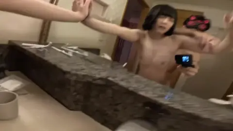 Asian Couple Intimate Moments in Hotel Room
