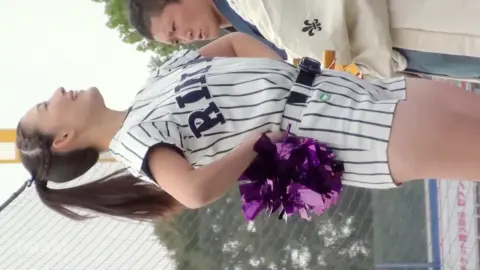 Asian Cheerleaders in Baseball Uniforms
