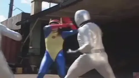 Asian Women in Costumes Engage in Fighting Poses