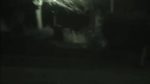 Couple Kissing in Public Restroom