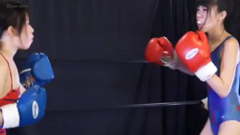 Asian Women Boxing in Ring