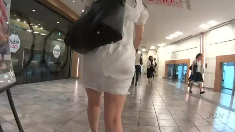 Asian Girl in White Dress at Mall