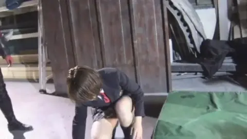 Uniformed Women Wrestling and Posing