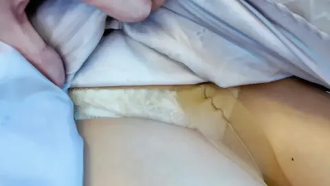 Asian Woman Exposed in Intimate Car Scene