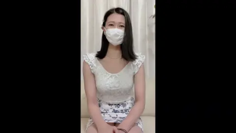 Asian Woman in White Floral Dress