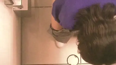 Asian Girl Urinating in Bathroom