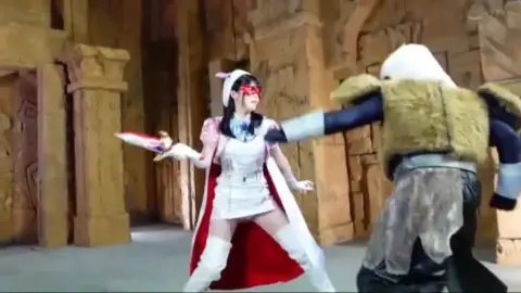 Asian Warrior Couple Engage in Swordplay