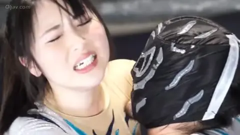 Asian Couple Wrestling in Ring