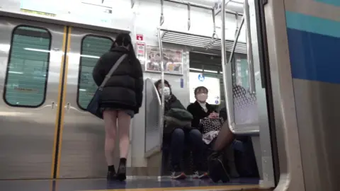 Upskirt Shots of Asian Woman on Train