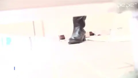 Asian teen in boots urinates in bathroom