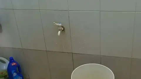 Nude Woman Pouring Water