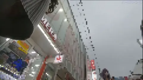 Asian Teen Lifting Skirt on City Street