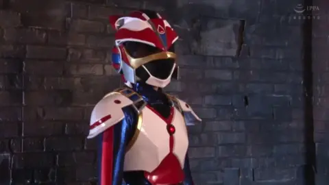 Asian Women in Red, White, and Blue Costumes Posing