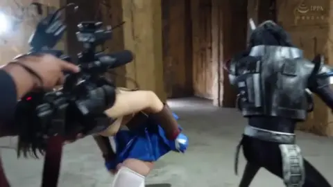 Asian Warrioress in Blue Costume Fights with Sword