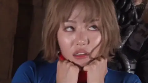 Blonde Asian Supergirl Restrained in Dungeon