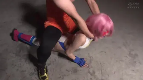 Couple Wrestling in Joker Mask Scene