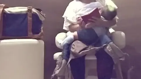 Asian Lesbians Breastfeeding in Nursing Room