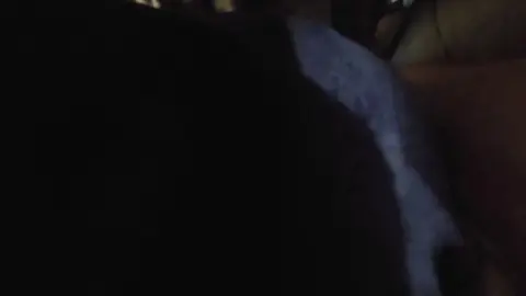 Caucasian Men Intimate Moments in Crowded Space