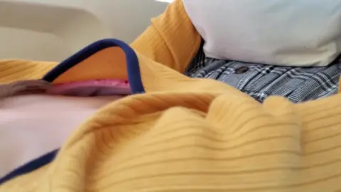 Brunette in Yellow Sweater Exposes Herself