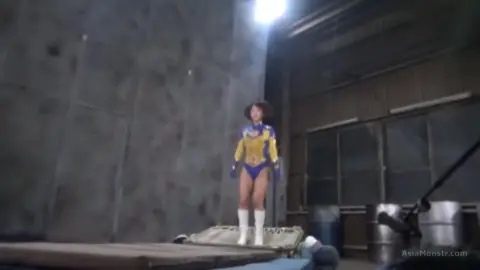 Asian Cosplay Erotica in Industrial Setting