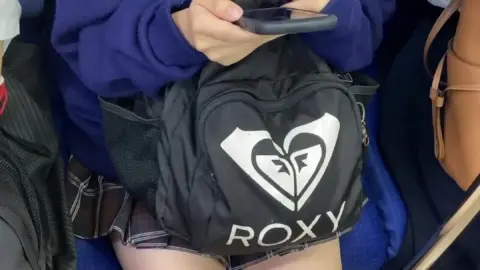 Asian Teen Girl on Public Transport