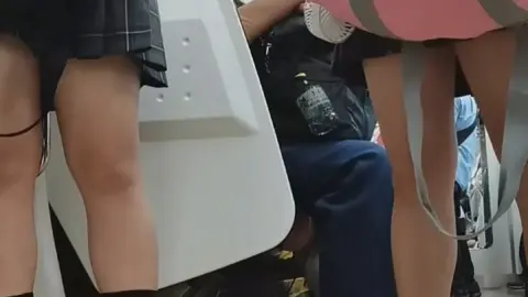 Schoolgirls in Uniform on Public Transport