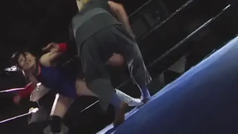 Asian Woman in Leotard Wrestling