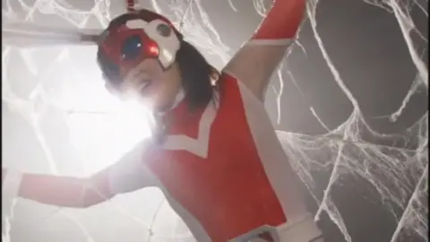 Asian Lesbians in Costumes Engage in BDSM Play