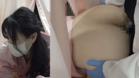 Asian Couple Gynecological Exam